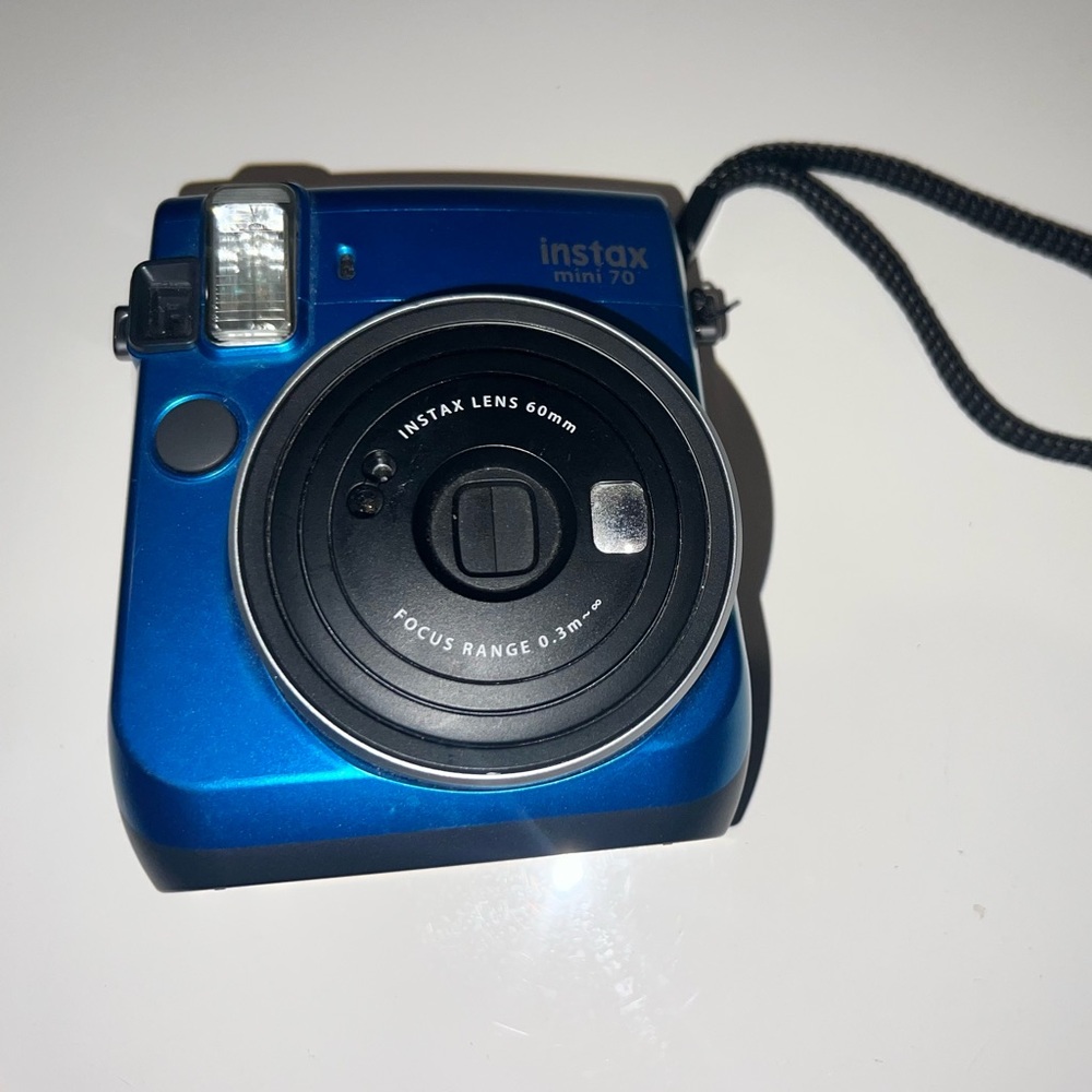 Blue Instax mini70 polaroid camera